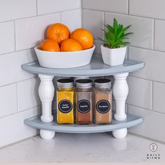 there is a shelf with spices and oranges on it