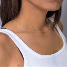 Dainty yet eye-catching, this gold choker necklace adds a simple touch of elegance to any outfit. Wear it alone or with your other gold jewelry as a layered necklace. * satellite chain with a pattern of cable chain with tiny balls * Available in 14k gold fill or sterling silver * Lengths are available from 15 - 20 inches You may add a 1 inch attached extender with the link below. https://www.etsy.com/listing/671508839/custom-add-on-extender-for-necklace?ref=shop_home_active_2&frs=1 Your new Minimalist Beaded Chain Layered Necklace, Dainty Station Necklace With Satellite Chain, Minimalist Everyday Beaded Chain Layered Necklace, Minimalist Beaded Chain Layered Necklace As Gift, Gold Minimalist Layered Necklace With Beaded Chain, Minimalist 14k Gold Filled Layered Necklace, Minimalist Station Necklace With Satellite Chain As A Gift, Minimalist Station Necklace With Satellite Chain For Gift, Minimalist Station Necklace With Satellite Chain