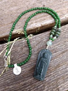 "Carved Buddha JADE pendant and darker green beads accented with light green aventurine beads.   All natural stones.  Finished with a sterling silver lobster clasp.  This necklace measures an approximate 18\" inches in length. Plus the drop length of approximately 2.25\" Pendant measures approx 1.75\" in long.  All jewelry will be shipped in a gift box or pouch at my discretion.  Please check out my other listings for more jewelry :)" Vintage Carved Jade Pendant And Beaded Necklace, Spiritual Green Beaded Necklaces With Natural Stones, Green Aventurine Beaded Hand-strung Necklace, Spiritual Jade Beaded Pendant Necklace, Green Single Strand Spiritual Beaded Necklace, Single Strand Jade Beaded Necklace For Healing, Green Jade Beaded Necklace For Meditation, Spiritual Single Strand Jade Beaded Necklace, Green Hand-strung Pendant Necklace