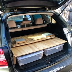 the back of a car with several boxes in it