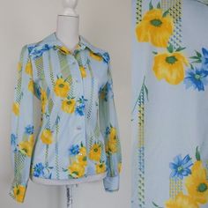 "Vintage late 60s floral blouse by David Keys co-ordinates. Fitted slim cut and large pointy collar. Material is stretchy polyester. Fits as a modern size M/L Measurements taken with shirt lying flat and doubled. Bust:  38\"/40\" Waist: 34\" Length: 23\" Shoulders: 15 1/2\" This shirt is in very good vintage condition." French Hat, 60s Floral, Light Blue Blouse, Pointy Collar, 30s Fashion, Blue Blouse, Floral Shirt, Floral Blouse, Shirt Top