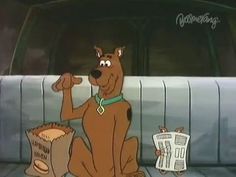 a cartoon dog sitting in the back of a car