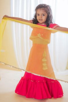 Fuchsia pink lehenga with tiered frill hem. Paired with floral, sequin embroidered blouse and dupatta.
Component: 3
Pattern: Embroidery
Type Of Work: Floral, sequin
Neckline: Round
Sleeve Type: Cap sleeves
Fabric: Roman Silk, Lining: Cotton
Color: Fuchsia,Pink
Other Details: 
Sheer dupatta
Occasion: Festive and Wedding - Aza Fashions Sheer Dupatta, Floral Lehenga, Pink Lehenga, Embroidery Floral, Color Fuchsia, Pattern Embroidery, Girl Online, Silk Embroidery, Fashion App