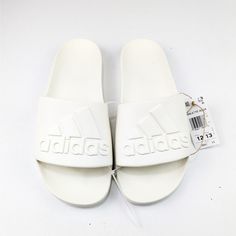 Adidas Unisex Adilette Logo Sandals, Creamy White, Size 12 Men's, 13 Women's, New With Tags White Comfortable Adidas Slides, White Non-slip Slip-on Sandals, Non-slip White Slip-on Sandals, Adidas White Slip-on Sandals, Adidas White Sporty Slides, White Non-slip Synthetic Sandals, White Synthetic Slides For Summer, White Synthetic Summer Slides, White Slip-on Slides For Spring