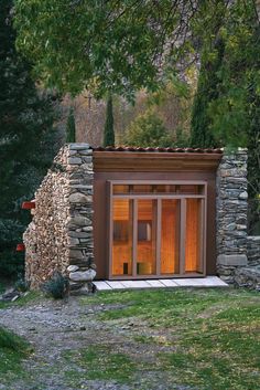 a small building made out of rocks and wood