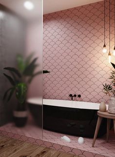 a bathroom with pink walls and flooring next to a bathtub