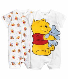 two baby onesuits with winnie the pooh on them