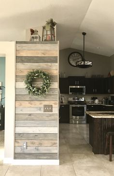 a kitchen with a wreath on the wall