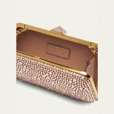 Valentino Garavani "Carry Secrets" clutch bag in allover rhinestones  Detachable chain shoulder strap Can be worn as a clutch or shoulder bag  Structured top with Roman Stud lift-clasp closure  Approx. 3.9"H x 8.3"W x 1.6"D Made in Italy Rectangular Bags With Gold-tone Hardware For Gala, Rectangular Gala Bag With Gold-tone Hardware, Designer Clutch With Gold-tone Hardware For Events, Rectangular Gala Bags With Gold-tone Hardware, Luxury Clutch With Gold-tone Hardware For Events, Luxury Bags With Chain Strap For Gala, Luxury Embellished Clutch For Cocktails, Cocktail Clutch Bag With Chain Strap, Designer Clutch Evening Bag For Gala