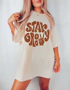 "PLEASE NOTE This is a standard unisex size Comfort Colors Tee. For an oversized tee, please size up. If you are looking for an oversized \"T-shirt Dress\" look, we recommend sizing up 2 sizes. Please review the size chart to ensure you receive the fit you want.---Unisex Crew Neck----- *Product Description * 100% ring spun cotton soft washed garment dyed fabric double needle collar twill taped neck and shoulders double needle armhole, sleeve and bottom hems as with all pigment dyed shirts colors White Crew Neck Hippie T-shirt, White Short Sleeve Groovy Tops, White Groovy Short Sleeve Tops, Groovy White Short Sleeve Tops, White Hippie Crew Neck T-shirt, Groovy Relaxed Fit Short Sleeve Tops, Groovy Short Sleeve T-shirt With Retro Print, White Relaxed Fit Hippie T-shirt, Groovy Crew Neck T-shirt With Retro Print