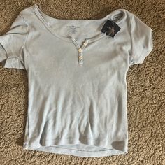 This Top Has Never Been Worn Before, Therefore Still Has The Tag. Brandy Melville Basics, Light Wash Fitted Cotton Top, Fitted Light Wash Cotton Top, Fitted Light Wash Short Sleeve Tops, Brandy Tank Tops, Bur Basket, Brandy Melville Clothes, Fitted Cotton Top, Zelly Top