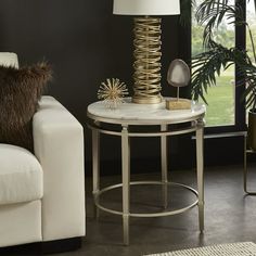 a living room scene with focus on the end table and chair, which has a white marble top