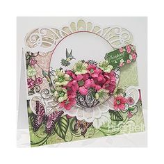 a card with flowers and butterflies on it