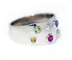 Create a comfortable mother's ring you can wear daily. Each gemstone is handset in a bezel setting to provide a smooth design. The gemstone are different sizes to represent each generation of grandmother, mother, children and grand-children. Contact us to learn more about our custom design services. DETAILS Material: Sterling Silver Synthetic gemstones 10mm tapered band Mother's Ring, Family Ring, Mother Family, Family Rings, Mother Rings, Family Jewellery, Wrap Rings, Jewelry Case, Jewelry Cleaner