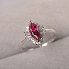 ◆ A marquise ruby ring clusters with baguette zircons, handcrafted with solid sterling sliver. A unique ring designed for multiple occasions. ◆ Production Description: Main stone Type: Lab Grown Ruby Main Stone Shape: Marquise Main Stone Size: 5*10mm Side stone: CZ Metal: 925 Sterling silver - Other options available in the drop down menu ◆ Customization: √Free for Add Engraving √Other Metal Type Available √Other Gemstones & Shapes Available √Personalization Requests Available ◆ Packaging: T Star Ruby Ring, Unique Ring Designs, Black Spinel Ring, July Birthstone Ring, Green Sapphire Ring, Minimalist Engagement Ring, Vintage Cocktail Ring, London Blue Topaz Ring, Half Eternity Ring