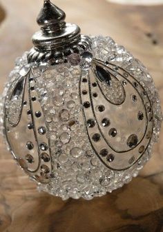 a glass ornament sitting on top of a wooden table