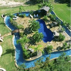 an aerial view of a backyard with a swimming pool