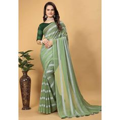 Green colored saree is made from georgette fabric which is highlighted with beautiful zari weaving striped pattern as shown. comes along with unstitched sequins embroidered net blouse which you can customise as per your design/style. Occasion - You can wear this saree for festive and functions, outing and get-together. Note:- the actual product may differ slightly in color and design from the one illustrated in the images when compared with computer or mobile screen. Measurements: Saree : George Festive Green Chiffon Blouse Piece, Pista Green Georgette Saree For Navratri, Pista Green Georgette Saree With Unstitched Blouse, Green Saree With Printed Border For Eid, Green Saree With Unstitched Blouse In Georgette, Green Georgette Dupatta With Printed Border, Green Georgette Saree With Self Design, Green Georgette Saree With Blouse Piece, Handloom Georgette Dupatta