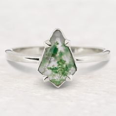 a white and green ring sitting on top of a table