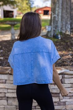 women's blue cropped basic tee The Easy Does It Blue Crop Tee will be your go-to for effortless style. This washed blue tee features an easy, cropped fit with a boxy silhouette for a comfortable and casual look. Perfect to pair with your black yoga or jogger pants! True to size Model is 5'3" wearing a small Semi cropped boxy fit Very soft Raw hem Fabric contains stretch Small length: 18.5" Small bust: 55" 100% cotton Easy Does It, Semi Cropped, Cami Maxi Dress, Black Yoga, Vintage Couture, Vintage Havana, Blue Tee, Dressy Tops, Midi Maxi Dress