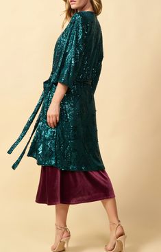 Beautiful dark teal long sequin kimono style duster. Featuring a tie at the waist and side slits. Pair with denim or wear over a dress to your next holiday party. ***Final Sale*** Fall Party Kimono, Fitted Wrap Kimono For Party, Chic Wrap Kimono For Parties, Fitted Open Front Kimono For Parties, Spring Party Wrap Kimono, Sequin Duster, Dress Bar, Sequin Kimono, Long Sleeve Sequin