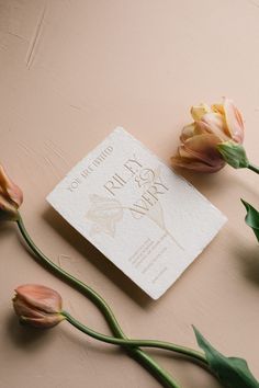 some flowers and a card on a table