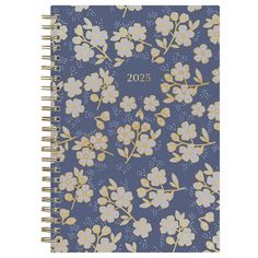 a blue notebook with yellow and white flowers on it