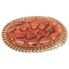 This fabulous carved art deco bakelite and brass trimmed oval pin brooch will make any outfit sing. The brass is overlapping loops as the exterior. This is not a common bakelite pin. The color of the bakelite has beautiful tones of orange amber brown. Deco Orange, Bakelite Jewelry, Art Deco Brooch, Amber Brown, Art Deco Pattern, Miriam Haskell, Pin Art, 1920s Art Deco, 1930s Art Deco