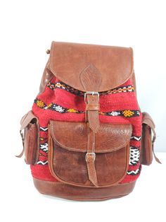 Handcrafted Moroccan Leather Boho Kilim Backpack Bag Carpet/Rug Medium Size.  Very good overal condition.  No cracks, no stains, gently used, only a few times.  Some signs of normal usage.  No missing buckles.  Nothing major to report.  Super clean.  Perfectly usable, plenty of life left.  Handmade in Morocco. Dimensions: 16'' x 12'' x 6'' please refer to the pictures for visual references, they are part of the description -The item will be shipped one or two days after payment is received. -Shi Handmade Travel Backpack, Artisan Backpack For Travel, Artisan Travel Backpack, Artisan Brown Backpack For Travel, Artisan Backpack For Daily Use, Casual Handmade Brown Backpack, Handmade Leather Satchel Backpack For Travel, Traditional Rectangular Backpack For Travel, Casual Brown Handmade Backpack