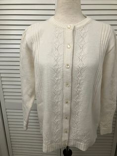 "Vintage white acrylic cardigan pearlized buttons unique cutwork pattern sweet go w/ everything cardigan sweater Made in USA like new vintage. Machine washable and dry. Highpoint Sprtwear  label  Shoulder 16\" Chest 22\" pit to pit (44\" buttoned) Sleeve 22 1/4\" ( 26 3/4\") Length 24 1/2\" from bottom of neck to bottom of hem Bottom 44\" 8 buttons" Elegant White Cable Knit Cardigan, White Daywear Sweater With Button Closure, White Pointelle Knit Cardigan For Daywear, Vintage White Cardigan With Buttons, Classic White Sweater With Buttons, Vintage White Cardigan With Button Closure, Elegant Cream Button-up Sweater, Classic White Sweater With Button Closure, Vintage Cream Button-up Sweater