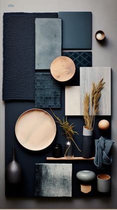 an assortment of plates, vases and other items on a wall with dark colors