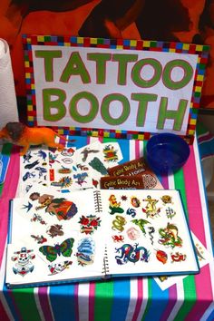 a table topped with lots of tattoos and stickers