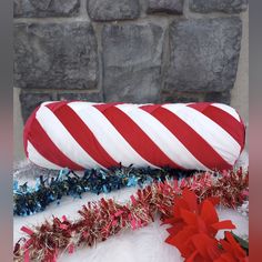 a red and white candy cane laying on top of a table