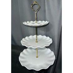 three tiered serving tray with gold handles