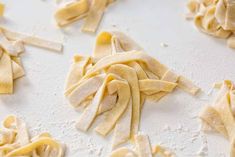 raw pasta being made on a white surface