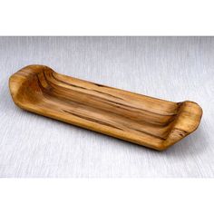 a wooden tray on a white table cloth