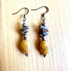 The autumn tones of Tigereye and Walnut Jasper will go with your whole fall wardrobe.  - Genuine Tigereye chips  - Walnut jasper beads  - nickel free ear wires - Antique Copper findings Find more of my earrings here: https://www.etsy.com/shop/fatcatbeads?section_id=42122010 Thank you for shopping with me! View all of my items here: www.fatcatbeads.etsy.com Artisan Brown Earrings With Natural Stones, Artisan Brown Beaded Nickel-free Earrings, Brown Adjustable Earrings With Natural Stones, Brown Dangle Earrings Nature-inspired, Nickel-free Earthy Brown Jewelry, Earthy Brown Drop Earrings, Nature-inspired Brown Dangle Earrings, Earthy Brown Nickel-free Jewelry, Earthy Brown Copper Earrings