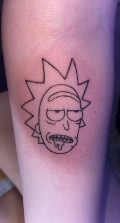 a person with a tattoo on their leg that has a cartoon character drawn on it