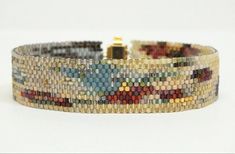 a multicolored beaded bracelet on a white background