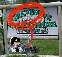 a sign that is in front of some grass and flowers with the words graves de house on it