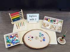 an assortment of crafting supplies displayed on a wooden table with the words explore with 7