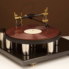 an old record player with three different types of records on it's turntable