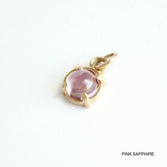 Starry Night Charm Pendant – Talāyee Elegant Pink Sapphire Gemstones Gift, Pink 14k Gold Jewelry With Charms, Pink Sapphire Gemstones Gift Round Shape, Pink Sapphire Gemstones As A Gift, Pink Sapphire Round Gemstones For Gifts, Round Pink Sapphire Gemstones For Gift, Modern Pink Gemstone Jewelry, Pink Sapphire Gemstone Jewelry Gift, Dainty Pink Sapphire Gemstone Jewelry