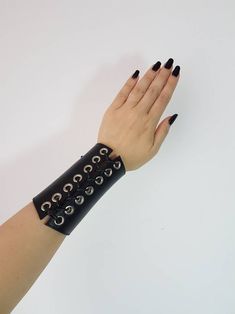 Black Rock Jewelry, Punk Style Leather Cuff Bracelet, Punk Style Black Wristband For Festivals, Punk Festival Wristband With Rivets, Edgy Rivets Jewelry, Black Punk Wristband For Concert, Rock Style Wristband With Rivets For Concerts, Punk Style Leather Cuff Bracelet With Wrist Strap, Black Punk Festival Bracelets