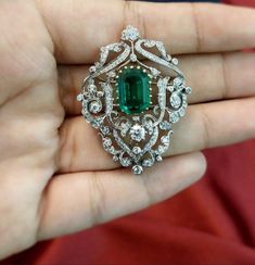 Diamond moissanite silver brooch very beautiful and handmade items Weight 23.500 gm (approx) Diamond weight 6.50ct Excellent cut Color Royal Emerald synthetic  Color weight 8.50ct metal  Sterling silver  Brooch finishing in silver Good cut in all Moissanite Diamond  thank you ✍🏻 𝒮𝒽𝒾𝓂𝓂ℯ𝓇𝒾𝓃ℊ, 𝓼𝓹𝓪𝓻𝓴𝓵𝔂 𝓪𝓷𝓭 𝓲𝓻𝓻𝓮𝓼𝓲𝓼𝓽𝓲𝓫𝓵𝓮.𝓦𝓮'𝓿𝓮 𝓰𝓸𝓽 𝓽𝓱𝓮 𝓹𝓮𝓻𝓯𝓮𝓬𝓽 𝓪𝓬𝓬𝓮𝓼𝓼𝓸𝓻𝔂 𝓽𝓸 𝓶𝓪𝓽𝓬𝓱 𝔂𝓸𝓾𝓻 𝓵𝓸𝓸𝓴 𝓽𝓸𝓭𝓪𝔂.. 𝑇𝐽 𝑓𝑟𝑜𝑚 𝑔𝑖𝑓𝑡 𝑓𝑟𝑒𝑒 𝑠ℎ𝑖𝑝𝑝𝑖𝑛𝑔 Emerald Brooch, Brooch Diamond, Sterling Silver Brooch, Brooches Handmade, Silver Brooch, Classic Elegant, American Diamond, Diamond Shape, 365 Days