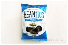 a bag of beanitos sitting on top of a white table next to a wall