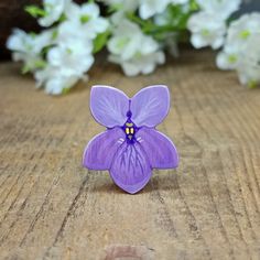 Handmade Violet Pin This hand painted violet pin would make a great February birthday gift as it is the birth flower for February. In the language of flowers these flowers mean 'thoughts of you', so you could give it to a friend or loved one to show you are thinking of them.  WHY   YOU'LL   LOVE   IT     * Totally unique - you won't find this flower anywhere else on Etsy!     * It's small and highly detailed     * You can see the brushstrokes of the artist who has signed it on the back     * Individually gift wrapped and beautifully presented using plastic-free packaging (100% recyclable)     * Shipped in a box which fits through a letterbox so you don't need to be in to receive the package     * A message card painted and printed by the artist is available to include with your purchase GR Lavender Flower Brooch For Gift, Handmade Purple Brooches For Gifts, Small Flower Gift, February Birth Flower, February Birth Flowers, Violet Earrings, February Birthday Gifts, Purple Gift, February Birthday