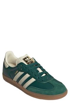 From the soccer pitch to the streets, this always-original sneaker maintains its legacy with luxe leathers and iconic 3-Stripes at the sides. Leather upper/textile lining/synthetic sole Imported Womens Green Sneakers, Womens Adidas Sneakers Outfit, Green Sambas Outfit Women, Leather Sneakers With White Sole And Three Stripes, Classic Leather Sneakers With Three Stripes, Women’s Trendy Sneakers 2024, Adidas Samba Shoes Outfit, Green Sambas Outfit, Women’s Casual Sneakers