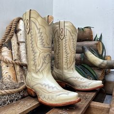 A women's western boot is a stylish and versatile footwear option that combines the classic design elements of a traditional cowboy boot with feminine touches and modern flair with a Eye-Catching Embroidery. These boots are specifically tailored to fit a woman's foot and offer a unique blend of fashion and functionality * Bone color and leather sole cowgirl boots for women with a 9 in boot shaft height and a 1.50-inch heel. * Premium leather construction sourced from Mexico, ensuring high-quality material. * Classic Western silhouette design provides a stylish and contemporary look, blending western charm with modern fashion. * Cowgirl boot that is Handcrafted by skilled artisans, offering authenticity and attention to detail in every stitch. * Designed for comfort with a cushioned insole White Western Boots For Country Events, Southwestern Style Snip Toe Boots For Country Events, Western Snip Toe Boots For Country Events, Western-style Snip Toe Heeled Boots For Western-themed Events, Southwestern Snip Toe Boots For Ranch, Western Style Boots For Western-themed Events, Western-style Heeled Boots For Western-themed Events, Southwestern Snip Toe Ranch Boots, Beige Fitted Western Boots