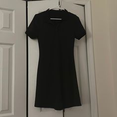 Step Into Timeless Elegance With This Sleek Black Polo Dress, Exuding Sophistication And Style. In Excellent Condition And Never Worn, This Dress Is Ready To Become Your Go-To Wardrobe Staple. Crafted In A Size Small, It Offers A Flattering Fit That Effortlessly Combines Comfort And Fashion. Whether You Wear With Sneakers Or Opting For A Smart Casual Look, This Dress Is Versatile And Chic. All Offers For This Dress Are Considered, Ensuring A Fair And Personalized Shopping Experience. Don't Miss Smart Casual Look, Polo Shirt Dress, Black Polo Shirt, Black Polo, Polo Dress, Smart Casual, Wardrobe Staples, Timeless Elegance, Casual Looks